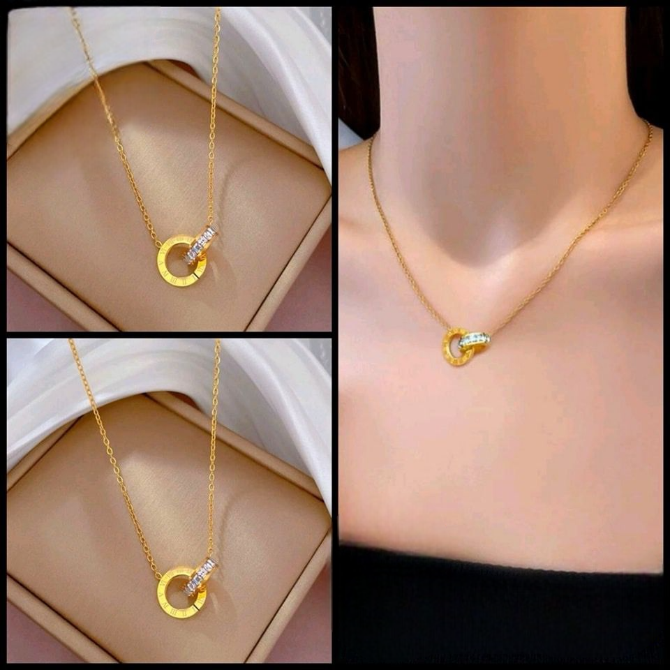 Gold plated necklace with a pendant with two circles linked together