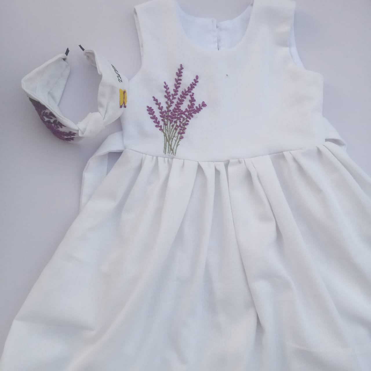 White baby Frock  with purple floral trim